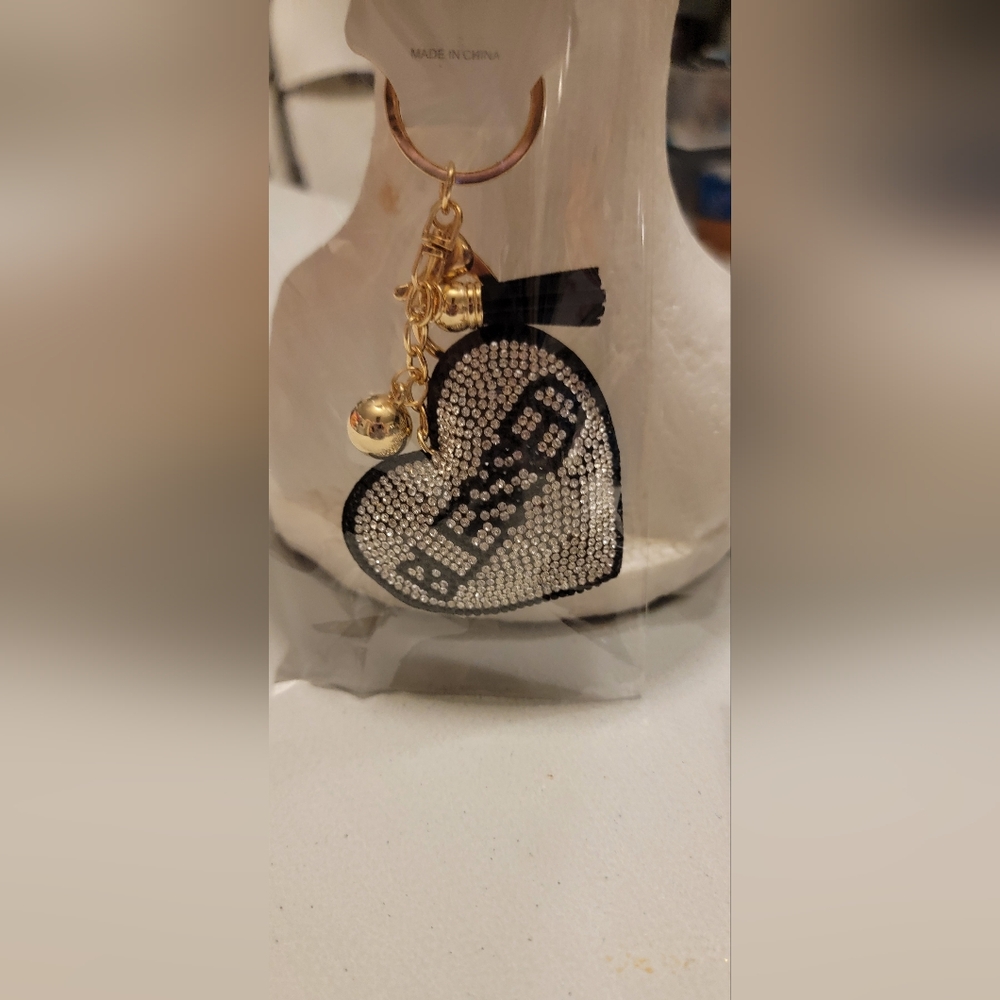 New in package blessed rhinestone black and silver keychain